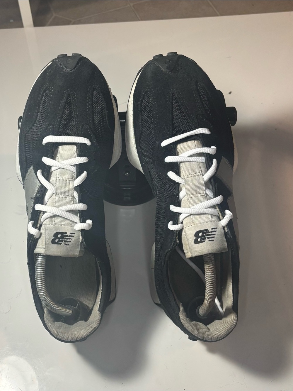 New Balance men Black and White Athletic Sneakers